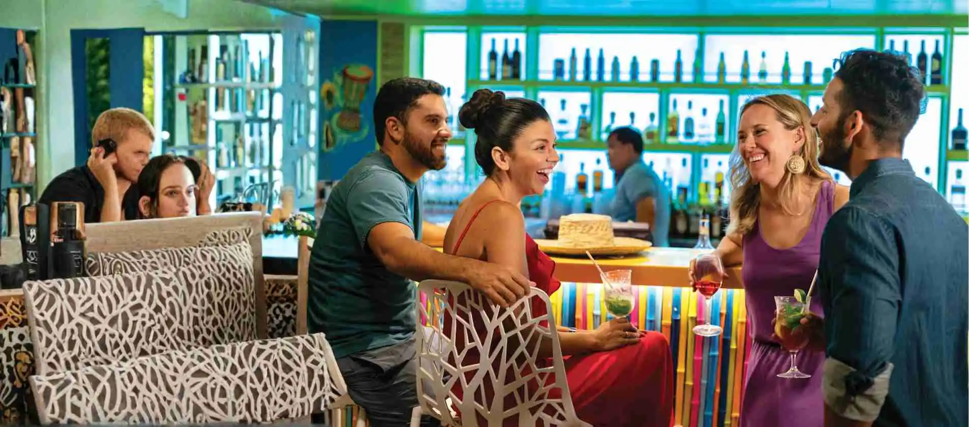 Guests enjoying cocktails and socialising at a cruise ship bar